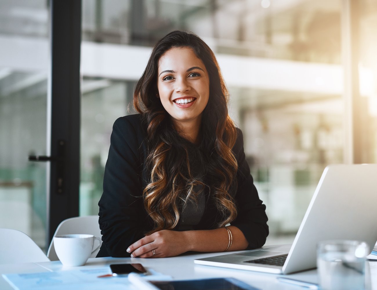A professional at her desk weighing her next career move